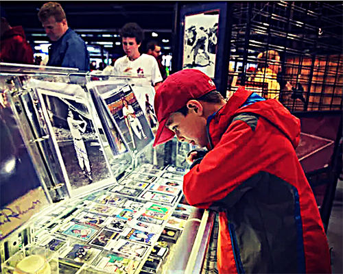 Image of a Kid looking at sports cards